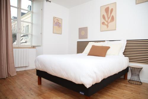 Katil atau katil-katil dalam bilik di Le D'lices, Spacieux, Centre-ville, Free parking