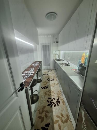 a kitchen with a counter and a table in it at Adrian's room in Dudu