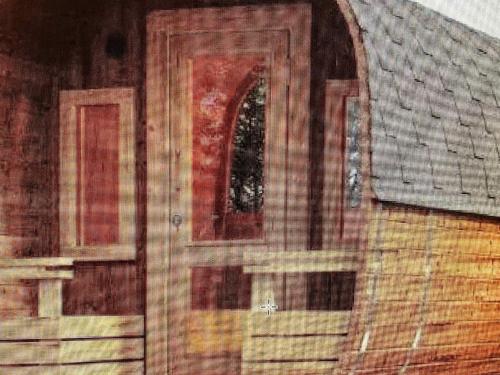 a wooden door of a house with a roof at 5 star holiday home in Højslev in Højslev