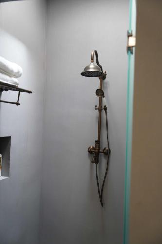 a lamp on the wall of a bathroom at Pure in Mexico City