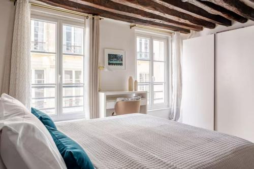Posteľ alebo postele v izbe v ubytovaní St Germain des Prés Appart