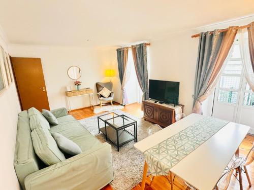 a living room with a couch and a table at Lisbon Baixa 208 Apartment-Chiado in Lisbon