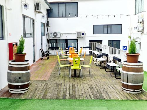 a patio with tables and chairs on a building at Hotel Firenze 2000 in Florence