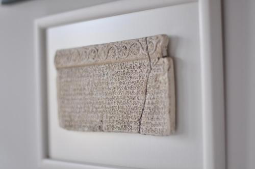 a picture of a book in a white frame at Apartment The Charm in Split