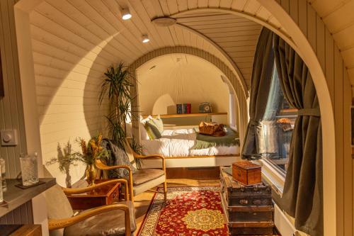a bedroom with an archway with a bed in it at The Forest at Mount Congreve Gardens in Kilmeaden