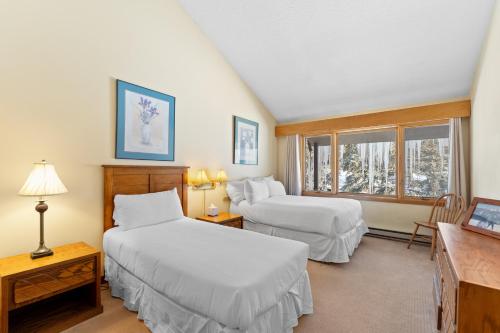 a hotel room with two beds and a window at Lenawee 1740 by Summit County Mountain Retreats in Keystone