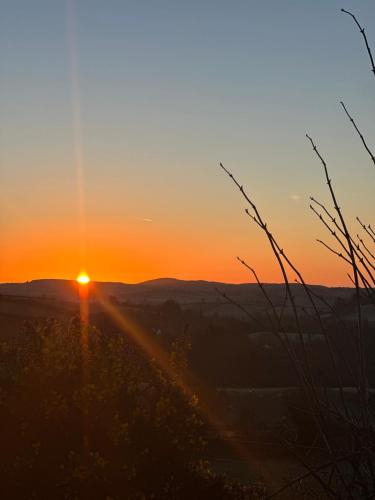 a sunset from the top of a hill at Luxury Sunrise Guest House County Down in Killyleagh