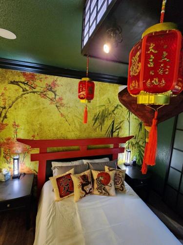 a bedroom with a large bed with chinese at Asian Zen Den in Sparks