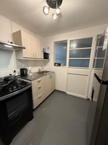 Dapur atau dapur kecil di Departamento impecable!