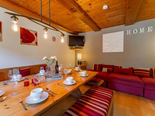 a living room with a table and a couch at Haus Weissbach in Griessen