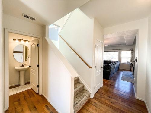 a hallway with a staircase and a sink in a house at Spacious Family Getaway 20min to downtown sights in Fountain