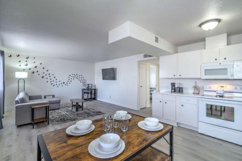 an open kitchen and living room with a table in a room at Vegas Getaway Near Strip! Sleeps 6! in Las Vegas