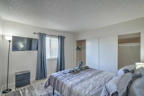 a bedroom with a bed and a flat screen tv at Your Vegas Home From Home! Sleeps 6! in Las Vegas