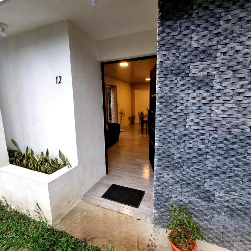 a hallway of a house with a stone wall at Casa Nael a 2Km del IRTRA in San Martín Zapotitlán