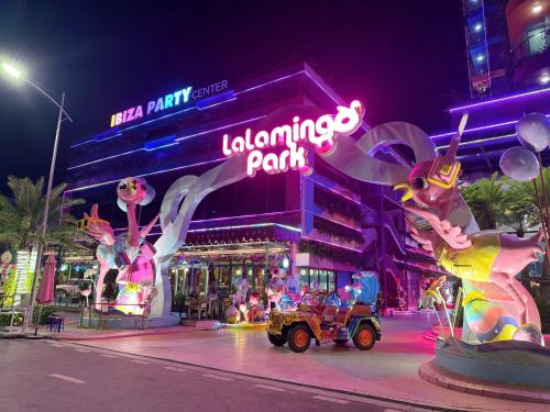 a building with a sign that readsalloween park at night at Flamingo Hải Tiến - Sỏi Apartment in Gò Ba Quần