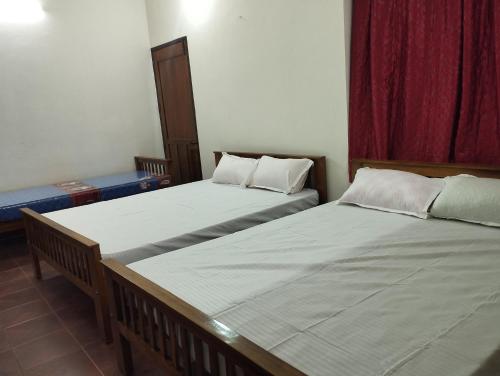 Katil atau katil-katil dalam bilik di Sree Vaishnavam Home Stay