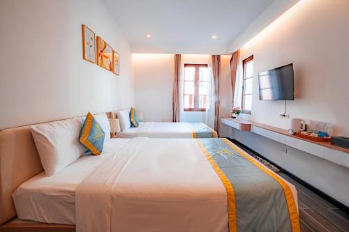 Postel nebo postele na pokoji v ubytování Lyn Hotel 2