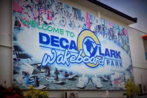 a sign for a baseball park on the side of a building at Up To 13 PAX near Clark Speedway & Aqua Planet in Angeles
