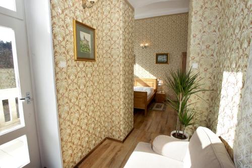 a hallway with a room with a bedroom at Hotel Štekl - Hrubá Skála in Hrubá Skála