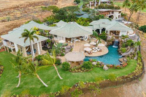 an aerial view of a house with a swimming pool at Hale 'O Ka La in Hapuna Beach