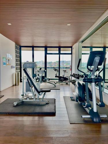 a gym with several treadmills and cardio machines at Tijuana Condo at Avenida Revolución 9th floor in Tijuana