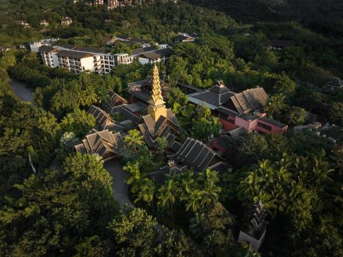 an aerial view of a temple in the middle of a forest at InterContinental Xishuangbanna Resort by IHG in Jinghong