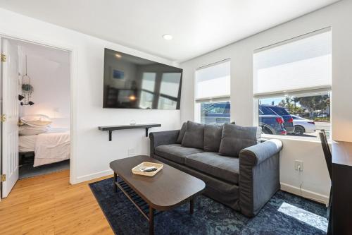 a living room with a couch and a table at Harborside Suite 08 with Hot Tub in San Diego