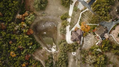 an overhead view of a park with trees and a road at Blair House Inn and Spa in Wimberley