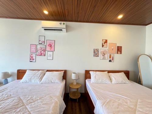 Letto o letti in una camera di Vile Villa- Homestay 2 Đảo Phú Quý