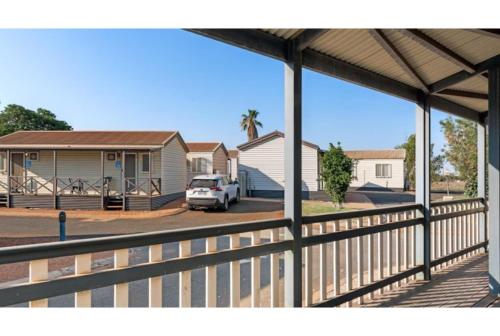 a house with a white car parked in a driveway at Discovery Parks - Port Hedland in Port Hedland