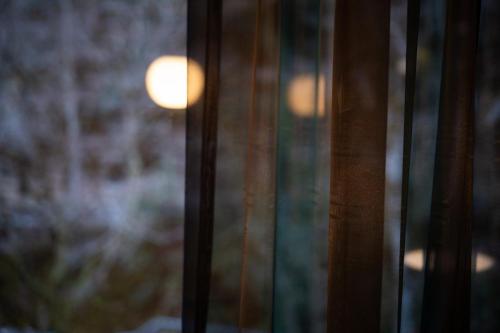 a close up of a glass door with a window at くらま温泉 in Kyoto