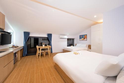 Postel nebo postele na pokoji v ubytování An Bang Spa & Apartment