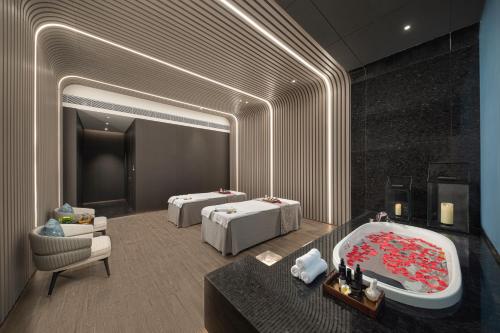 Ένα ή περισσότερα κρεβάτια σε δωμάτιο στο Hainan Sangem Moon Hotel