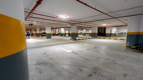 an empty parking lot in an empty parking garage at Brzeen Hotel Riyadh in Riyadh