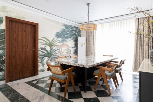 a dining room with a table and chairs at 4bhk-Villa at dlf valley township Panchkula in Panchkula