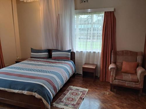 Postel nebo postele na pokoji v ubytování GRACEMONT Guesthouse