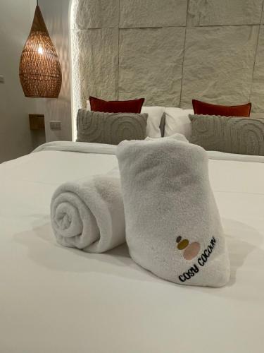 Ένα ή περισσότερα κρεβάτια σε δωμάτιο στο Cosy Cocon Kaeng Krachan