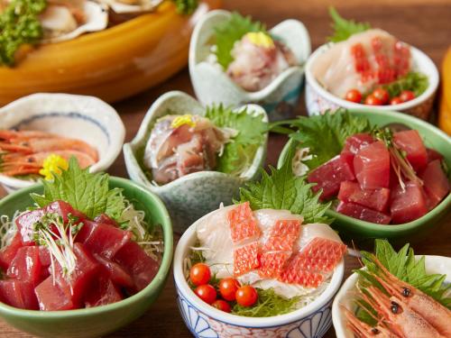 a group of bowls filled with different types of food at Hotel Ravie Kawaryo in Ito
