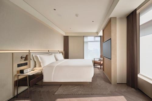 Katil atau katil-katil dalam bilik di Ming Hotel Nanjing - MGallery Collection
