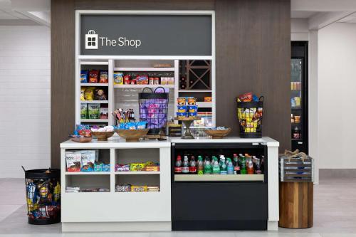 a store with a counter with drinks on it at Hilton Garden Inn Winston-Salem/Hanes Mall in Winston-Salem