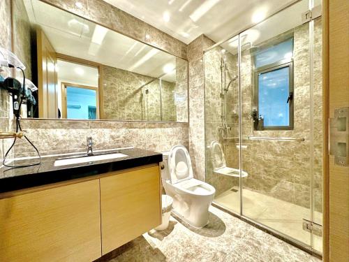 a bathroom with a toilet and a sink and a shower at R&F Seine Region in Johor Bahru