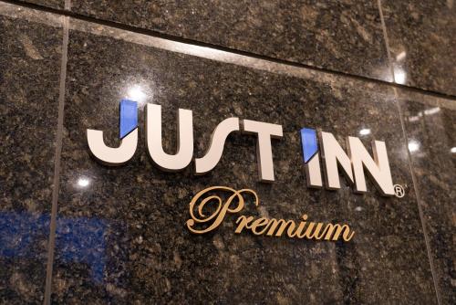a jumeirah logo on the side of a building at Just Inn Premium Toyohashi Station in Toyohashi