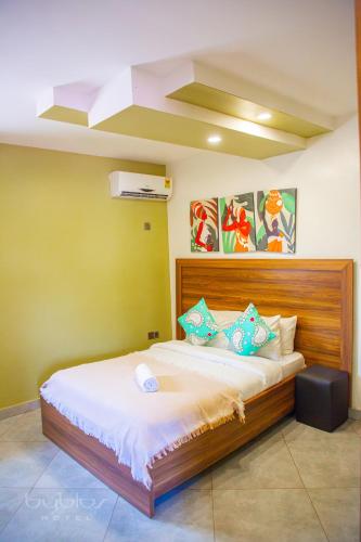 a bedroom with a large bed in a room at Byblos Hotel-Sky Osu in Accra