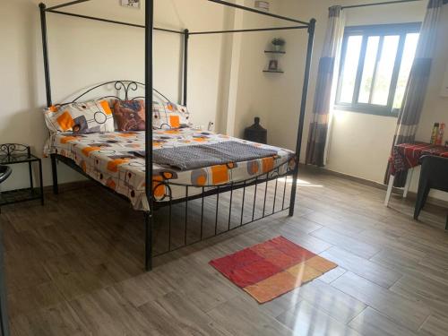 Postel nebo postele na pokoji v ubytování Villa Mimi's