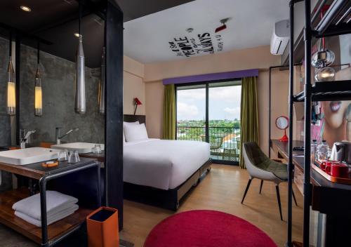 Postel nebo postele na pokoji v ubytování Viva Dash Hotel Seminyak
