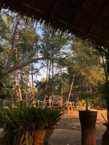 a view of a picnic table and some trees at Horizon Eco Resort in Ko Phra Thong