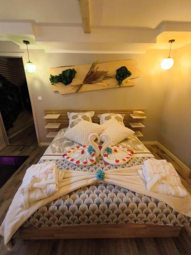 a bedroom with a bed with a bow on it at Paradise and Love Room in Haguenau