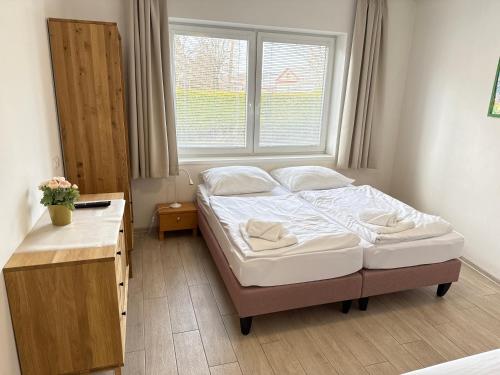 Postel nebo postele na pokoji v ubytování Apartmány LETO