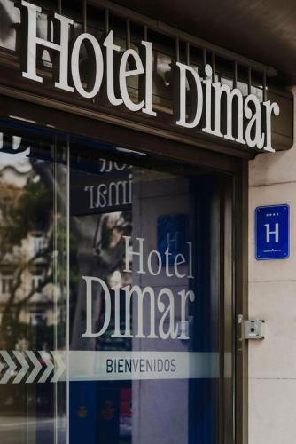 a sign on the front of a hotelartmentartmentvenant at Hotel Dimar in Valencia