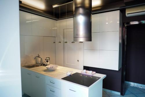 Kuchyň nebo kuchyňský kout v ubytování il cielo in una stanza